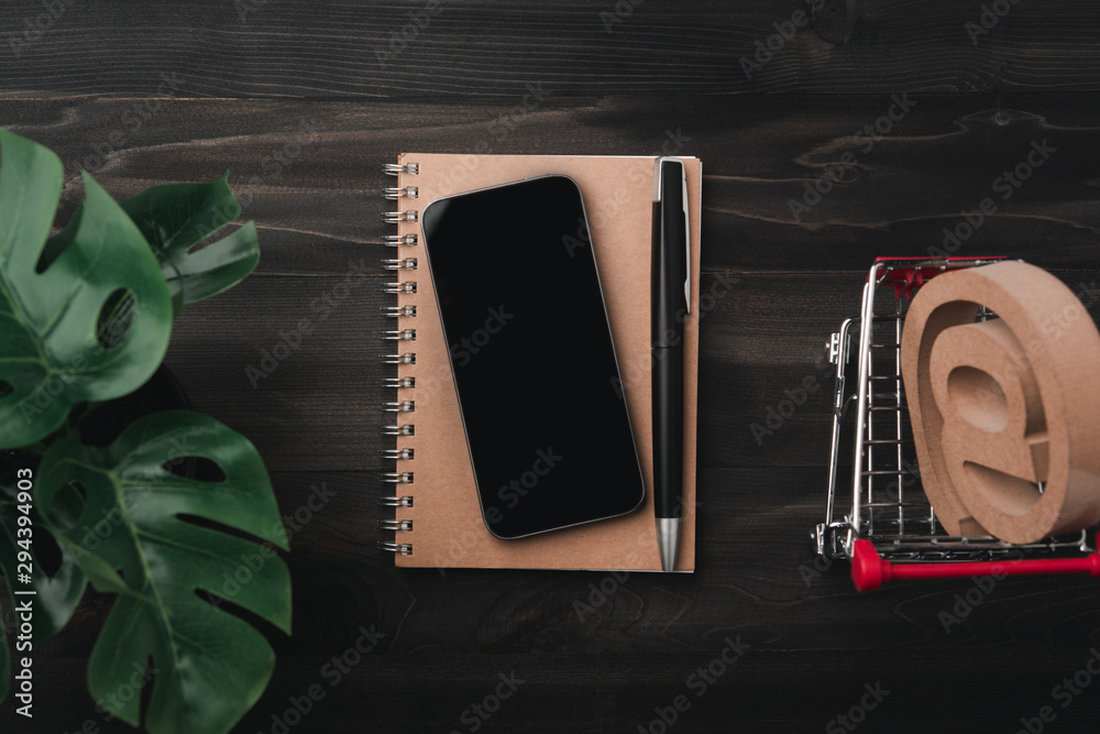 Poster creative workspace modern dark office desk with smartphone and pen on notebook,mockup topview