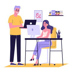 Young woman sitting at the desk and working on computer