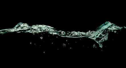 Water wave splash isolated black background.