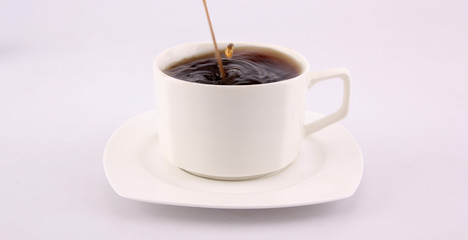 coffee splash from a cup isolated on white background.