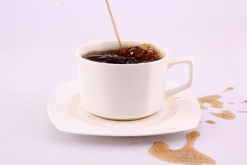 coffee splash from a cup isolated on white background.