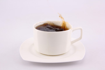 coffee splash from a cup isolated on white background.