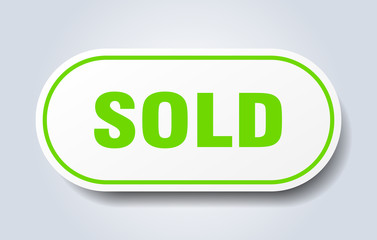 sold sign. sold rounded green sticker. sold