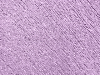 Texture decorative purple plaster imitating the old peeling wall.