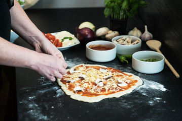 making homemade Italian-style pizza