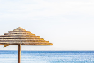 summer season vacation wallpaper poster picture of beach outdoor scenic view straw umbrella...