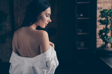 Behind view profile photo of hot model lady half naked waiting husband return home taking off shoulders his white shirt perfect honeymoon surprise indoors