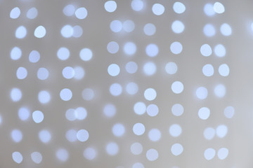 Beautiful and soft blurry bokeh background from blue garland.