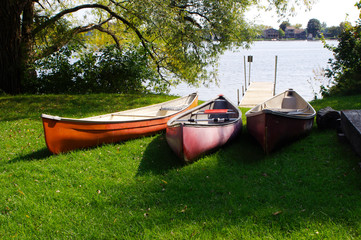 three canoes at water's edge