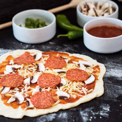 making homemade Italian-style pizza