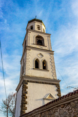 Fototapeta na wymiar Metropolitan Church or Church of the Assumption of St. Mary bell tower from 1892 in the town of Samokov, Sofia Province, Bulgaria