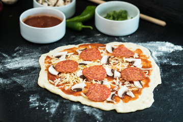 making homemade Italian-style pizza