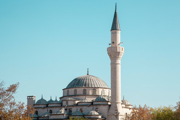 a white mosque with minaret