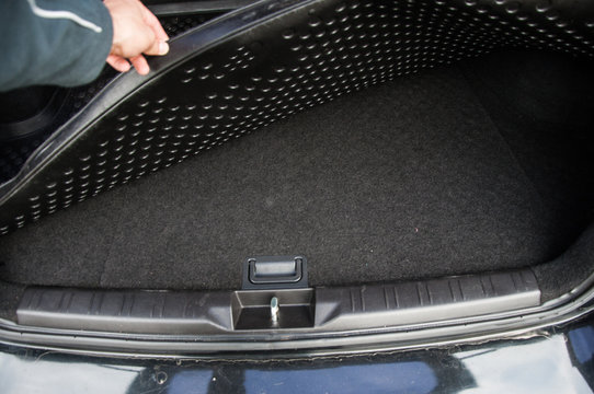 Space For Spare Tire Under The Boot Mat Of The Car.