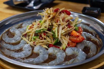 Green Papaya Salad (Som tum) is spicy and Fresh shrimp