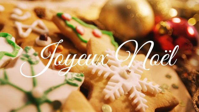 Joyeux NoÃ«l written over Christmas cookies