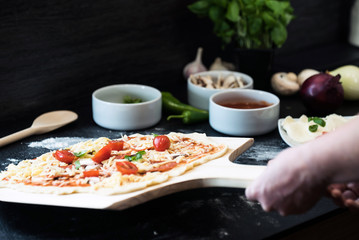 making homemade Italian-style pizza