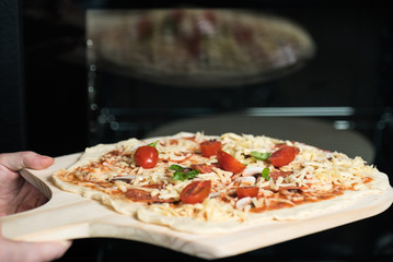making homemade Italian-style pizza