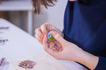 Designer making handmade brooch