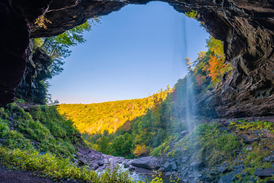 Beautiful autumn waterfall upstate New York featuring mountains on the background. 