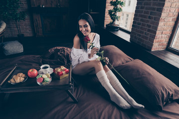 Portrait of her she nice attractive charming pretty cheerful cheery dreamy girl sitting on bed...