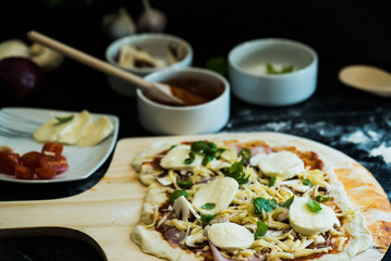 making homemade Italian-style pizza