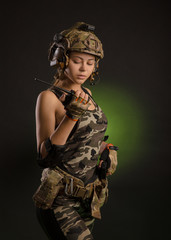 a girl in a military uniform helmet says on the radio