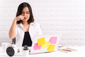 Sick woman at office with fever