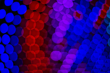 colorful bokeh effect abstract unfocused background illumination from red blue and purple spot light