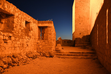 Saint Michaels Fort in Sibenik, Croatia between sunset and night.