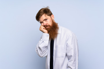 Businessman with long beard over isolated background unhappy and frustrated