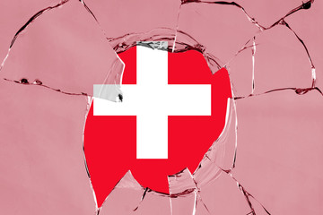 Flag of Switzerland on a on glass breakage.
