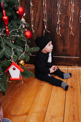 Happy fun child paying at home on Christmas time. Xmas holiday concept