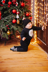 Happy fun child paying at home on Christmas time. Xmas holiday concept