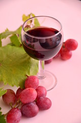 glass of red wine and grapes
