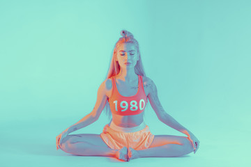 Athletic young woman doing yoga exercise