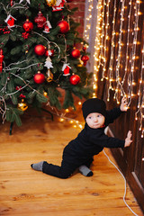 Happy fun child paying at home on Christmas time. Xmas holiday concept