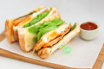 Egg Sandwich and green oak lettuce with ketchup.