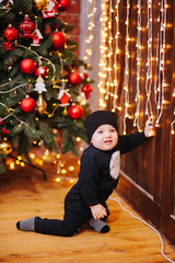 Happy fun child paying at home on Christmas time. Xmas holiday concept