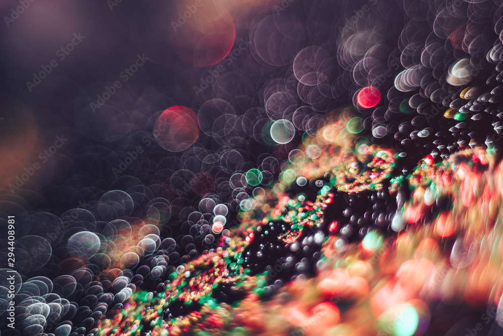 Poster beautiful light bokeh on a red white and darkness background.