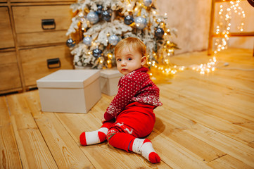 Happy fun child paying at home on Christmas time. Xmas holiday concept