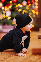 Happy fun child paying at home on Christmas time. Xmas holiday concept