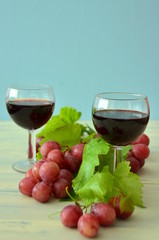 glass of red wine and grapes