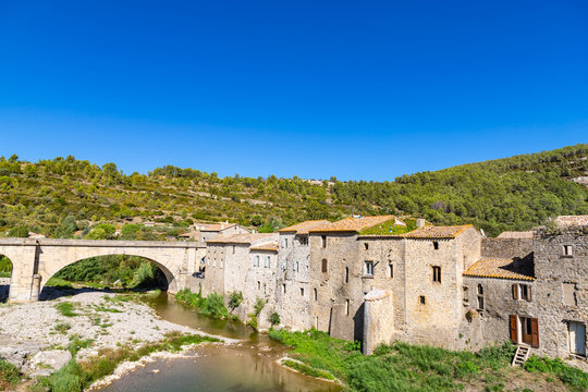 Medieval vaulted arch bridge over Orbieu river in Lagrasse, France