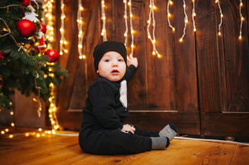 Happy fun child paying at home on Christmas time. Xmas holiday concept