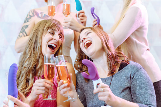 Best friends having fun during an adult toy party
