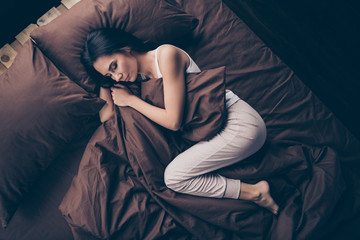 Top above high angle view portrait of her she nice attractive lovely winsome sleepy calm peaceful mature girl lying in bed having rest in room flat apartment house indoors