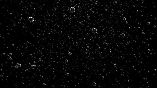 Large transparent bubbles fly up against the background of small bubbles. Dark animated background. Holidays concept.