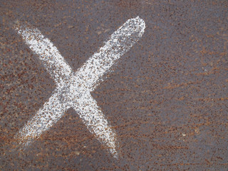 cross mark painted on rusty grunge steel floor with copy space