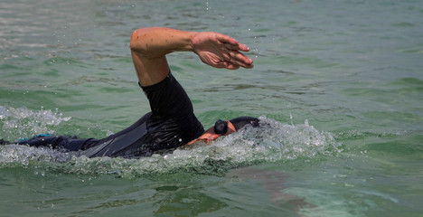 Triathlon swimmer at sea